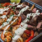 SHRIMP AND STEAK FAJITA BOWL WITH CREAMY SAUCE